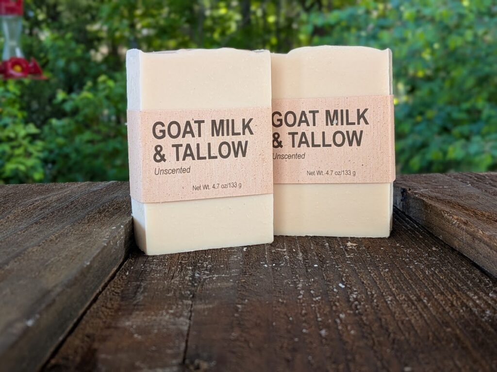 2 bars of our unscented Goat Milk & Tallow soap, standing on end.