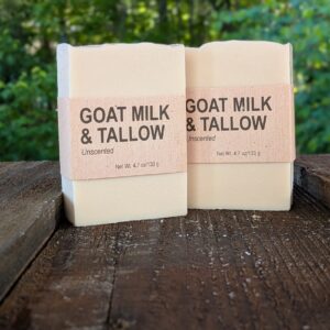 2 bars of our unscented Goat Milk & Tallow soap, standing on end.